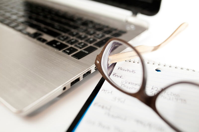 the laptop and glasses of a person